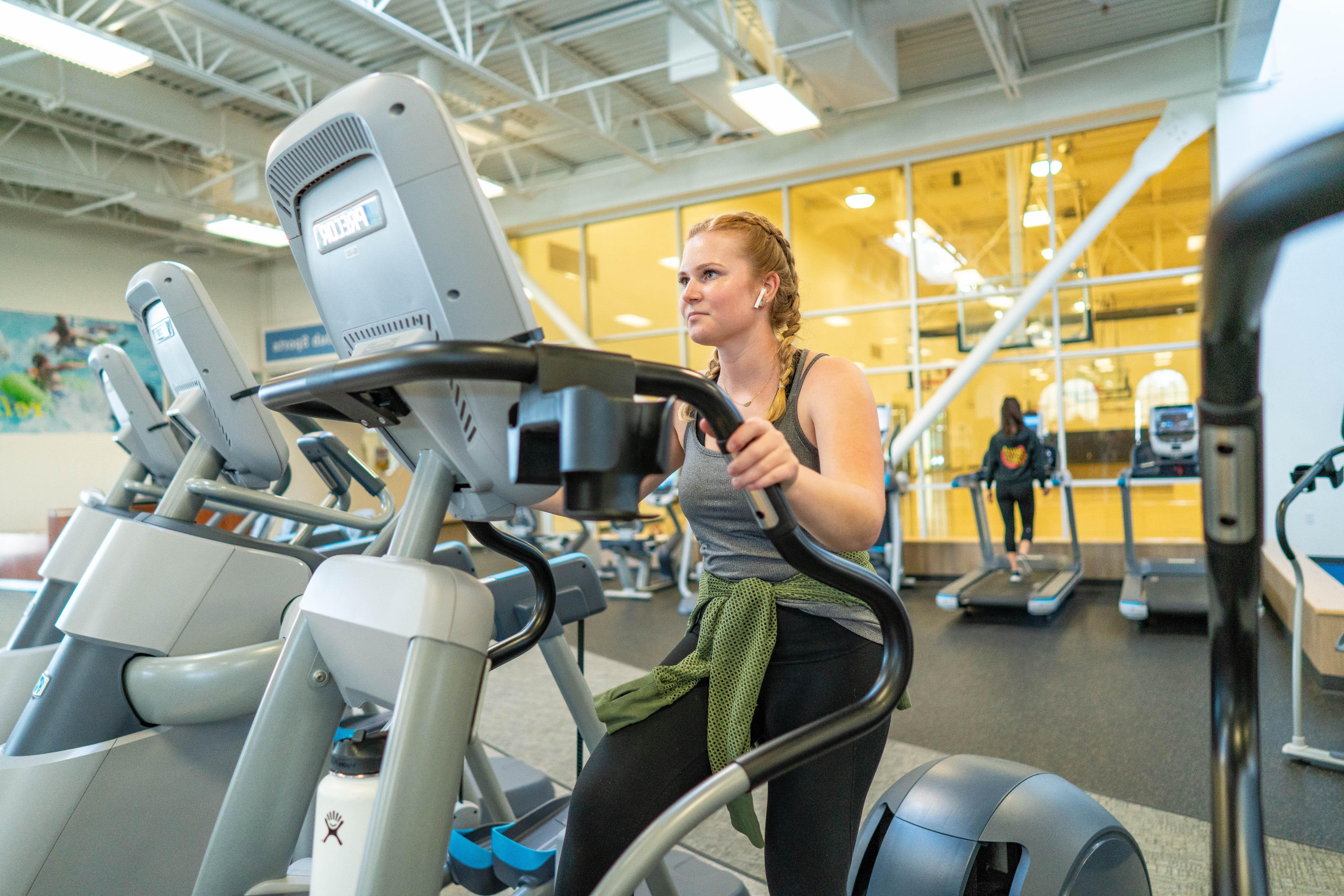 Student using cardio equipment at the rec center