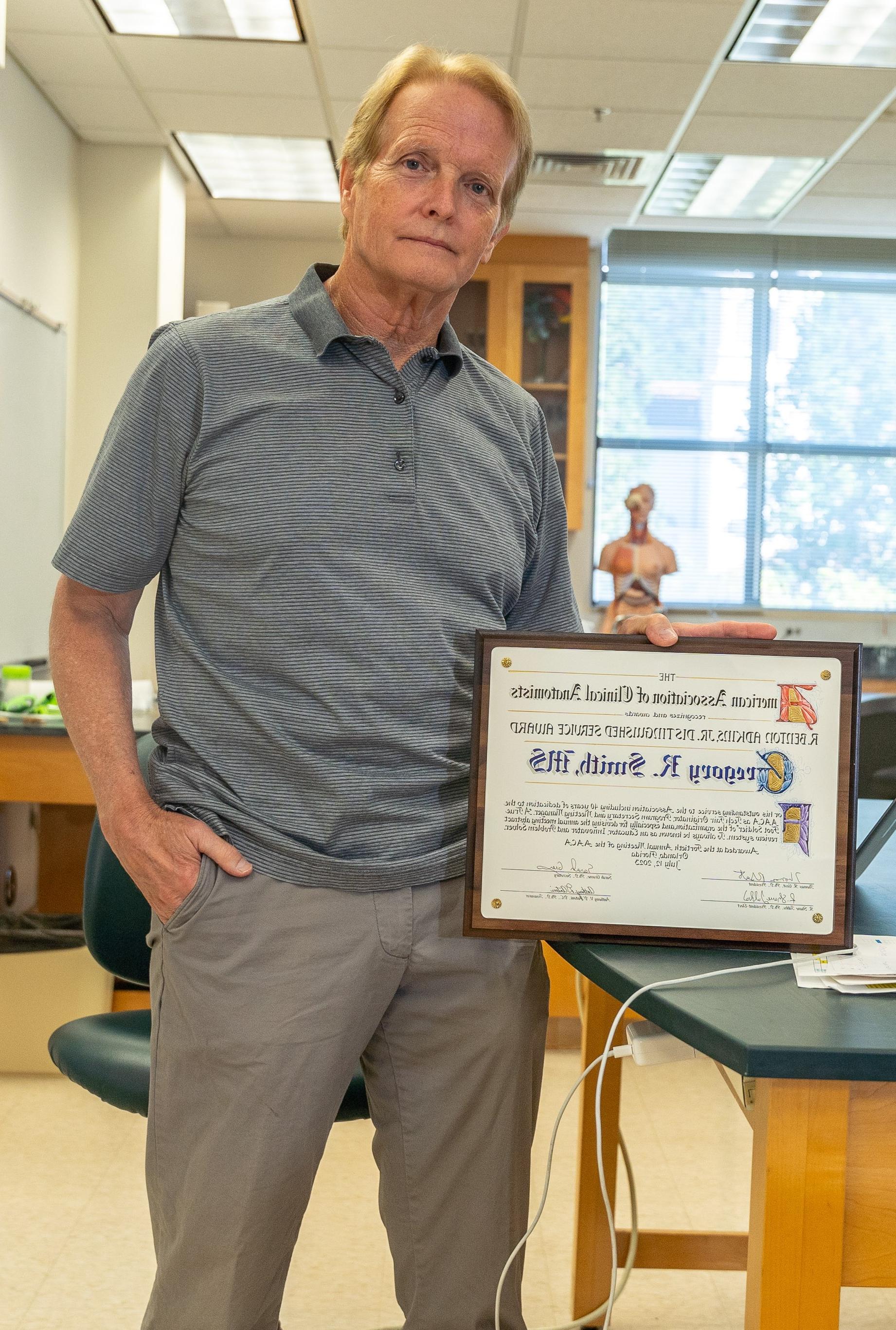 Greg Smith and his AACA plaque