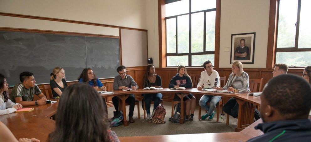 Students seating around a seminar table