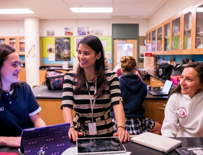 A teacher with students in a classroom