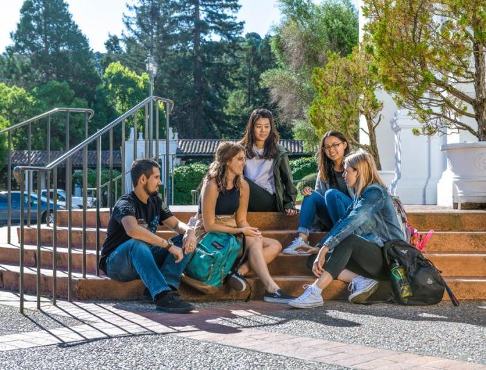 Students sitting together on steps of saint mary's college chapel